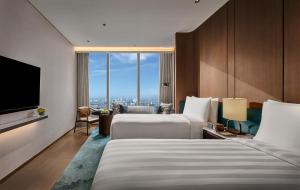 Pan Pacific Jakarta客房内的一张或多张床位