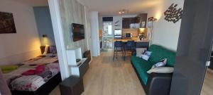 a room with a bed and a couch in it at Appartement Zen Costa Plana in Cap d'Ail