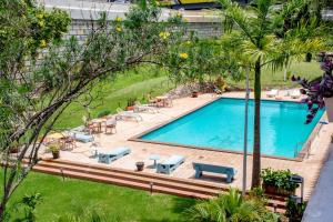 an overhead view of a pool with tables and chairs at Hotel Boulevard Nairobi, City Centre CBD in Nairobi