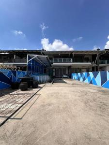 a large building with blue and white at H&H Homestay Premium House in Kepala Batas