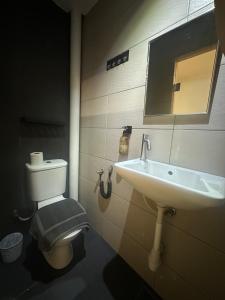 a bathroom with a sink and a toilet at D'Garden Hotel Kuala Lumpur in Kuala Lumpur +24 photos
