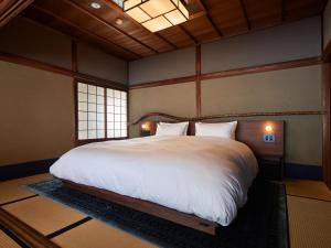 Una cama o camas en una habitación de 京の宿　石原