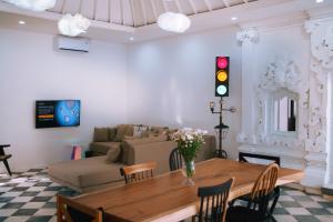 a living room with a table and a couch at PROMO! 2BRV With premium Pool in Uluwatu