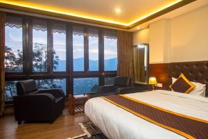Ένα ή περισσότερα κρεβάτια σε δωμάτιο στο Hotel Lha-yul nearby MG Road Gangtok +37 φωτογραφίες