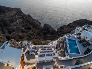 arial view of a cruise ship overlooking the ocean at Petit Palace Suites in Fira