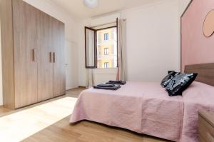 Postel nebo postele na pokoji v ubytování Pink Room
