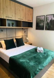 Posteľ alebo postele v izbe v ubytovaní CISZA Bungalows Village / Blisko Natury