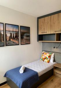 Posteľ alebo postele v izbe v ubytovaní CISZA Bungalows Village / Blisko Natury