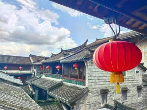 Зображення з фотогалереї помешкання Tulou Fuyulou Changdi Inn у місті Yongding