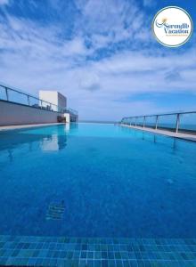 a large swimming pool on the roof of a building at Negombo Ocean View Luxury Studio by Serendib Vacation in Negombo