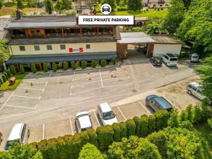 an aerial view of a parking lot in front of a building at Hotel Center Bohinjsko Jezero in Bohinj