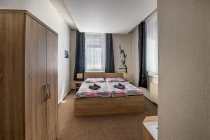 Voodi või voodid majutusasutuse Hotel & SPA centrum PALMIRA toas