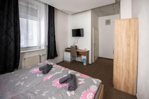 Voodi või voodid majutusasutuse Hotel & SPA centrum PALMIRA toas