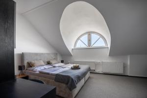 Voodi või voodid majutusasutuse Hotel & SPA centrum PALMIRA toas