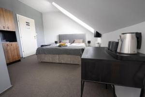 Köök või kööginurk majutusasutuses Hotel & SPA centrum PALMIRA