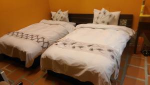 Letto o letti in una camera di PianoPiano B&B