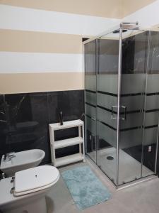 a bathroom with a shower and a toilet and a sink at Casa Alessandro in Rapallo