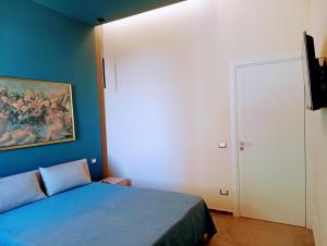Letto o letti in una camera di Rosso Marsala