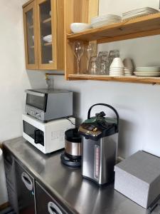 Kuchyň nebo kuchyňský kout v ubytování Roost Hostel Nikko