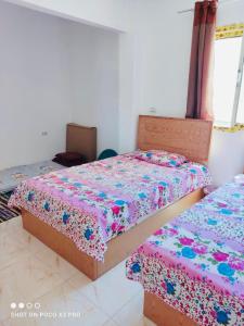 Postel nebo postele na pokoji v ubytování شاليه 90م بلو لاجون للعائلات فقط + 14 fotografií