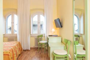 TV a/nebo společenská místnost v ubytování Hotel Minerva