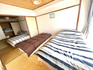 Kleines Zimmer mit 2 Betten in der Unterkunft Ueda Building - Vacation STAY 8565 in Asahikawa