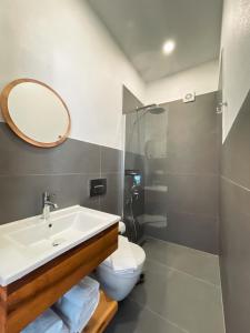 a bathroom with a sink and a toilet and a mirror at Casa Alegre Alaçatı in Alacati +80 photos