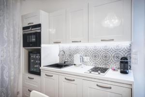 Dapur atau dapur kecil di Penta Apartments