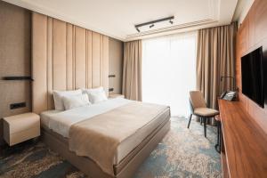 Posteľ alebo postele v izbe v ubytovaní Hotel Kocka Vrnjačka Banja