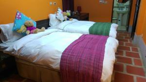 Letto o letti in una camera di PianoPiano B&B