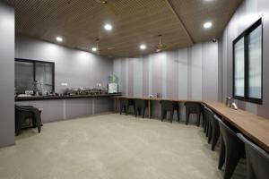 a conference room with a long table and chairs at Hotel U Life Residency Mumbai in Mumbai