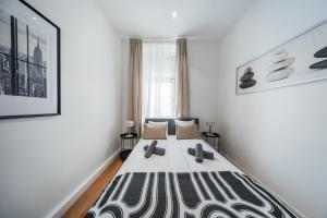 Postel nebo postele na pokoji v ubytování Nice Central City Room
