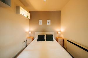 A bed or beds in a room at Apartamentos Stetic