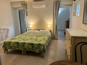 Letto o letti in una camera di Scalette Via Elia