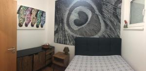 A bed or beds in a room at Golden Brown Apartment