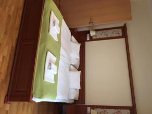 Postel nebo postele na pokoji v ubytování Mara Apartman