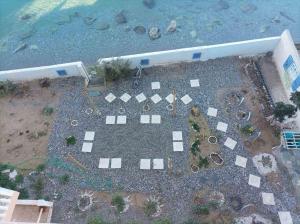 an aerial view of a building with a yard next to the water at Μαρια in Xylokastro