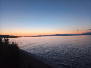 a sunset over a large body of water at Μαρια in Xylokastro