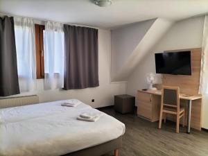 Postel nebo postele na pokoji v ubytování B3 Hotel