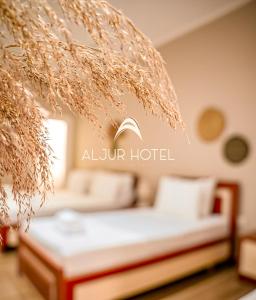 Postel nebo postele na pokoji v ubytování Aljur Hotel