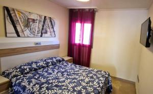 A bed or beds in a room at Vila de Oropesa Nº1053 Még 28 kép