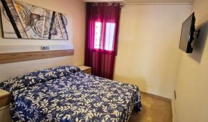 A bed or beds in a room at Vila de Oropesa Nº1053
