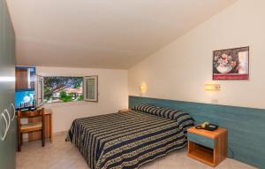 Postel nebo postele na pokoji v ubytování Hotel Apuana