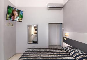 Postel nebo postele na pokoji v ubytování Hotel Apuana
