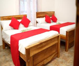 Rúm í herbergi á PKV Trinco Villas