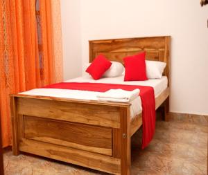 Rúm í herbergi á PKV Trinco Villas