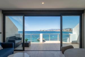 a living room with a view of the ocean at ARENAL SUITES BENIDORM in Benidorm