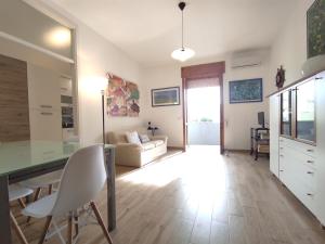 a living room with a couch and a table at Dimora Zoe sea view by CASASI Vacanze Otranto in Otranto