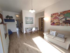 a living room with a couch and a table at Dimora Zoe sea view by CASASI Vacanze Otranto in Otranto