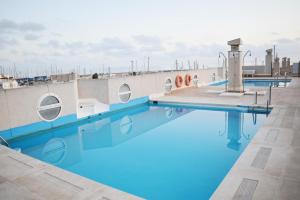 a swimming pool on the roof of a building at EXPOHOLIDAYS - Galeon PUERTO DEPORTIVO in Almerimar